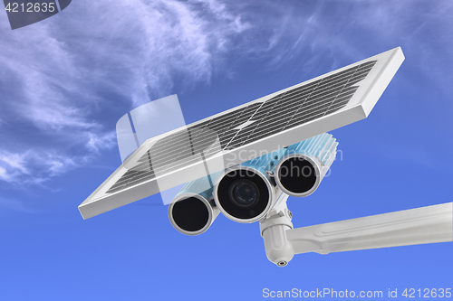 Image of Surveillance Camera with Solar Power blue sky as background