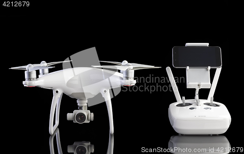 Image of White drone against black background.