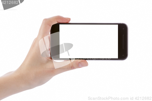 Image of Hand holding black smart phone isolated on white