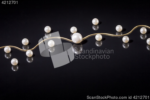 Image of White pearls necklace on black background