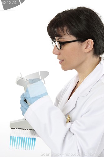 Image of Scientist programming pipette