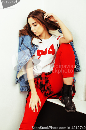 Image of young pretty teenage hipster girl posing emotional happy smiling on white background, lifestyle people concept 