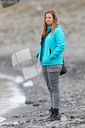 Image of Woman walking over the beach at Jokulsarlon glacier lagoon - Ice