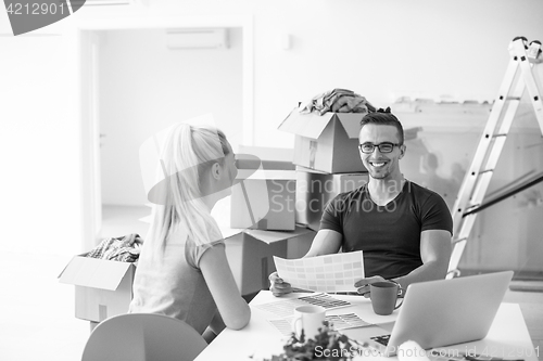 Image of Young couple moving in a new home