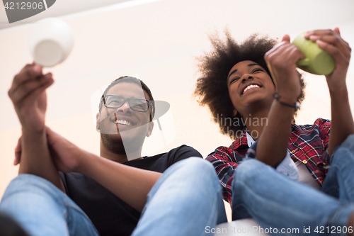 Image of couple having break during moving to new house