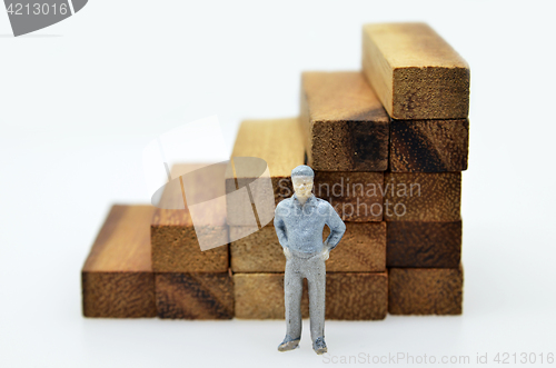 Image of Way to success with  businessman and wood block step