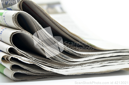 Image of Newspapers folded and stacked