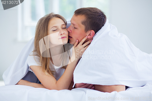 Image of Lifestyle. Beautiful couple in bed