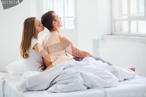 Image of Lifestyle. Beautiful couple in bed