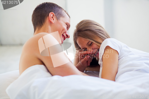 Image of Lifestyle. Beautiful couple in bed