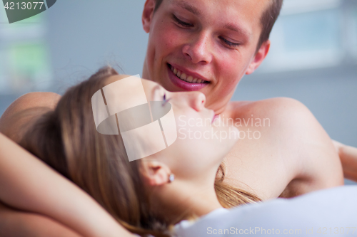 Image of Lifestyle. Beautiful couple in bed