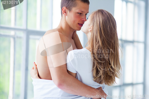 Image of Lifestyle. Beautiful couple in bed