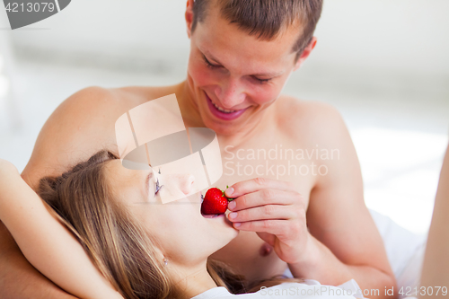 Image of Lifestyle. Beautiful couple in bed