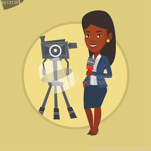 Image of TV reporter with microphone and camera.