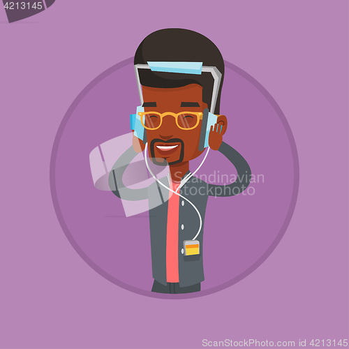Image of Young man in headphones listening to music.