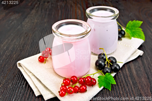 Image of Milk cocktail with red and black currant on napkin