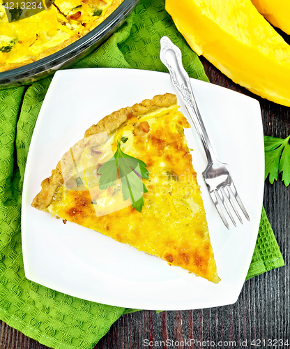 Image of Quiche with pumpkin and bacon in plate on board top