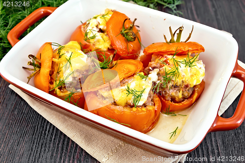 Image of Tomatoes stuffed with rice and meat in ceramic brazier