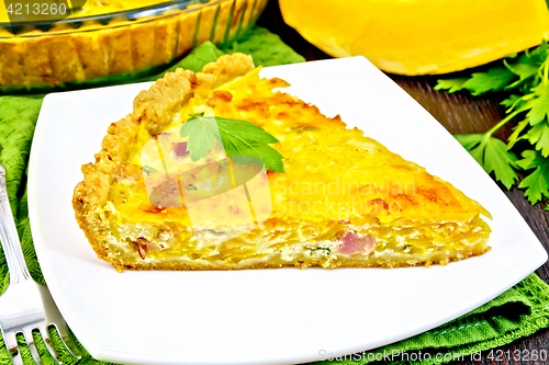 Image of Quiche with pumpkin and bacon in plate on towel