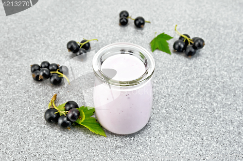 Image of Milk cocktail with black currant on stone table