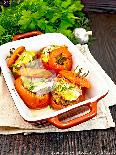 Image of Tomatoes stuffed with rice and meat in brazier on napkin