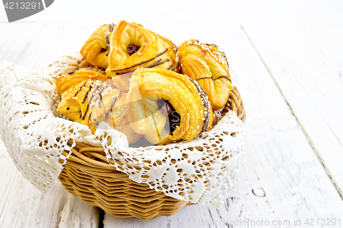 Image of Cookies with dates in basket with napkin on light board