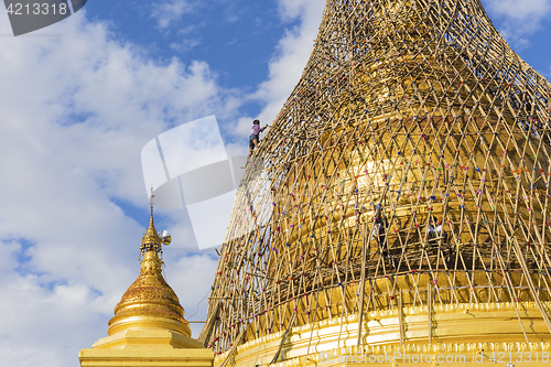 Image of Worker repareing golden temple