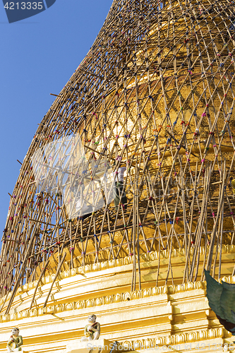 Image of Worker repareing golden temple