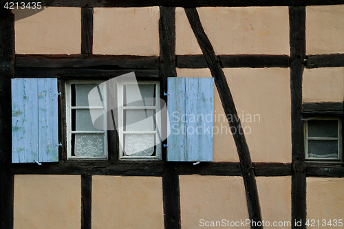Image of Half timbered house with blue shutter  at the ecomusee in Alsace
