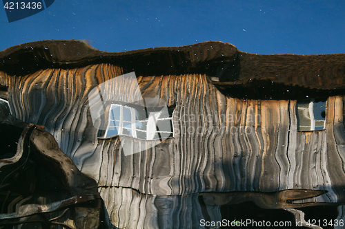 Image of Reflection of a wooden house at the ecomusee in Alsace