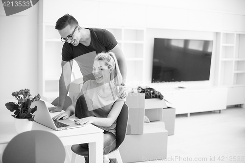 Image of Young couple moving in a new home