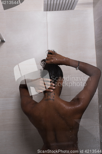 Image of African American woman in the shower