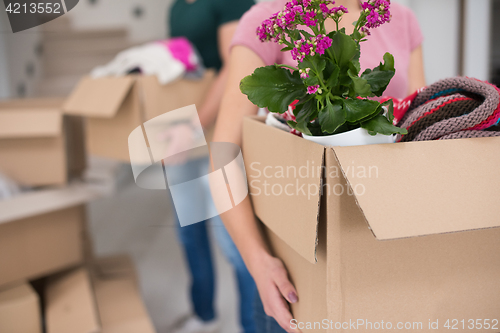 Image of young couple moving into a new home