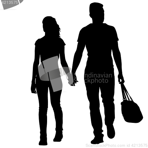 Image of Silhouette man and woman walking hand in hand