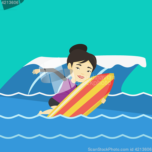 Image of Happy surfer in action on a surf board.