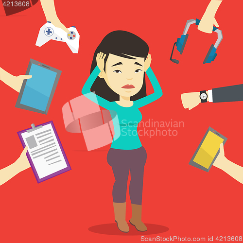Image of Young woman surrounded with her gadgets.