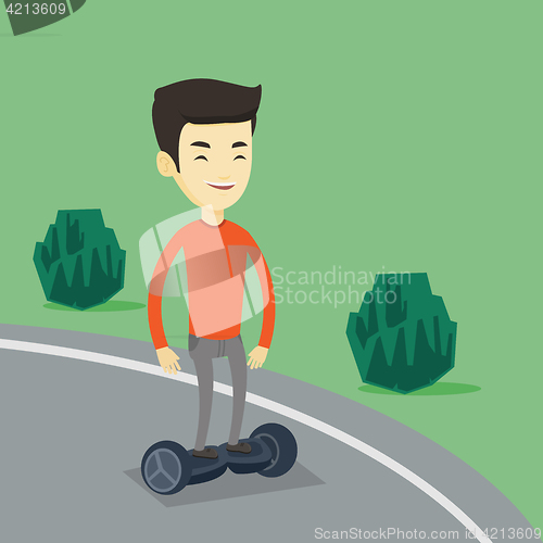 Image of Man riding on self-balancing electric scooter.