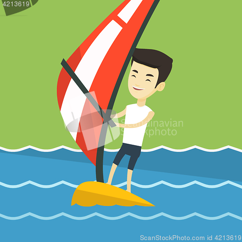 Image of Young man windsurfing in the sea.