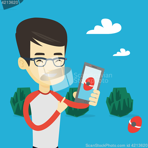 Image of Man playing action game on smartphone.