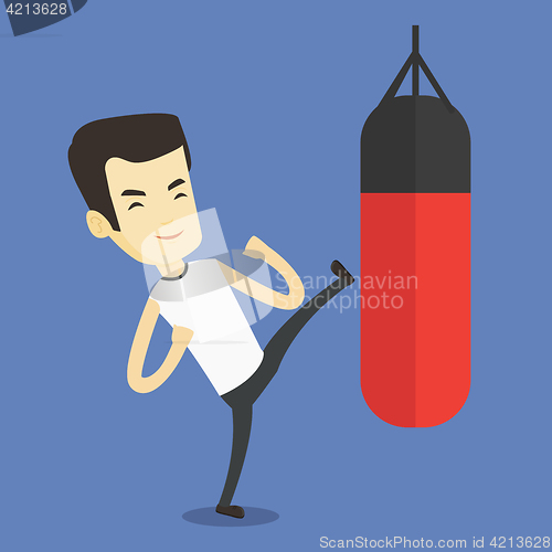 Image of Man exercising with punching bag.