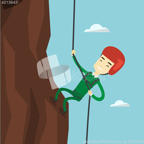 Image of Man climbing in mountains with rope.