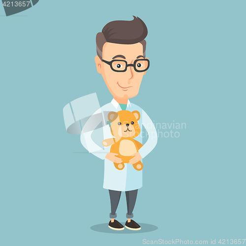 Image of Pediatrician doctor holding teddy bear.