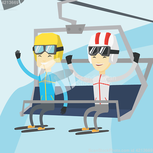 Image of Two happy skiers using cableway at ski resort.