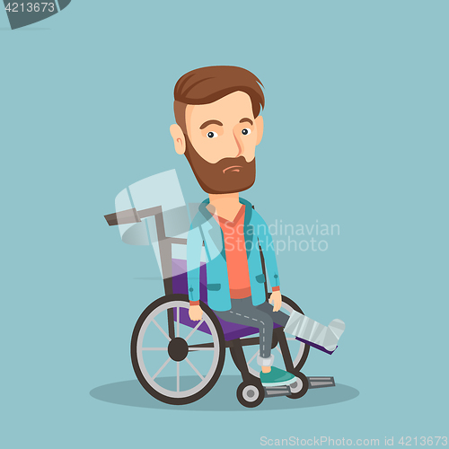 Image of Man with broken leg sitting in wheelchair.