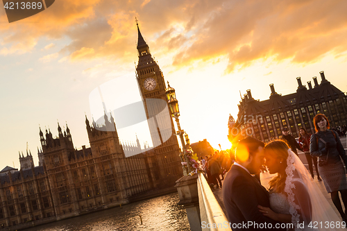 Image of Street scene of random people on Westminster Bridge in sunset, London, UK.