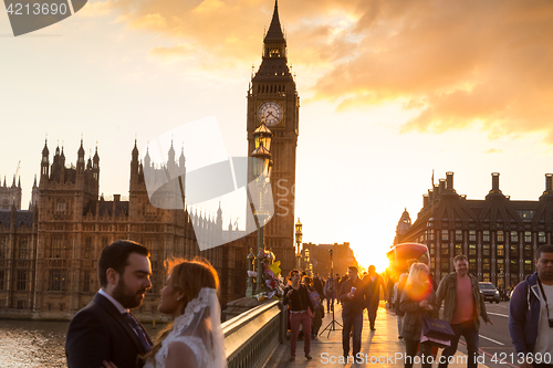 Image of Traffic and random people on Westminster Bridge in sunset, London, UK.