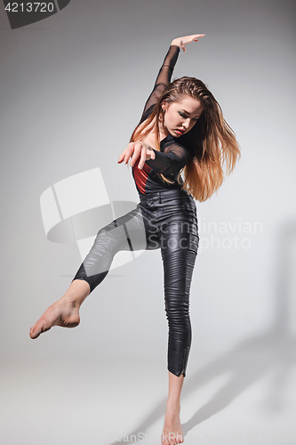Image of The woman dancing on gray