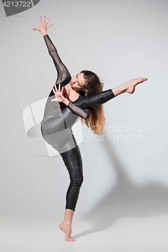 Image of The woman dancing on gray