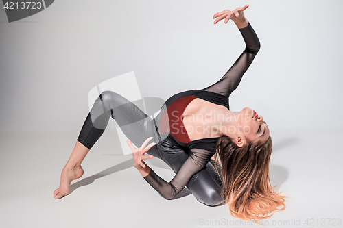 Image of The woman dancing on gray