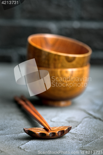 Image of wood bowl with wooden chopsticks